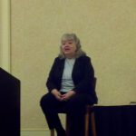 Image of a presenter at an OCRA conference